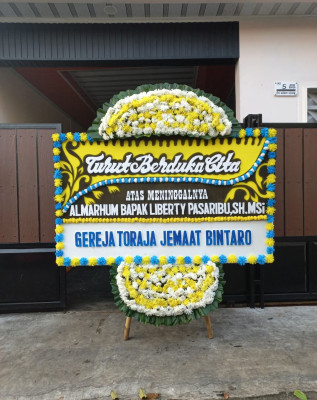 Papan Bunga Duka di Sukacai